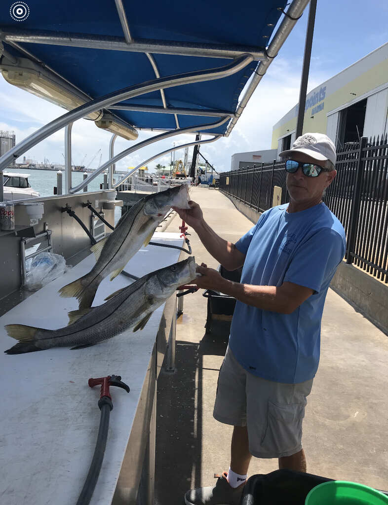   Man showing off catch from 3-hour trip